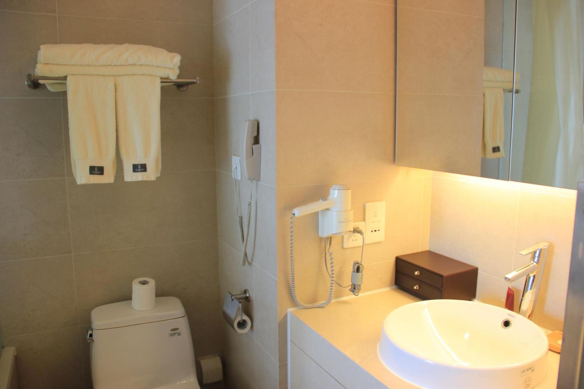 Green Park Hotel Tianjin Binhai  Quarto foto